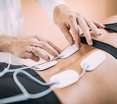 Modalities Physical Therapy from sos syracuse orthopedic specialists doctor using tens machine on patient