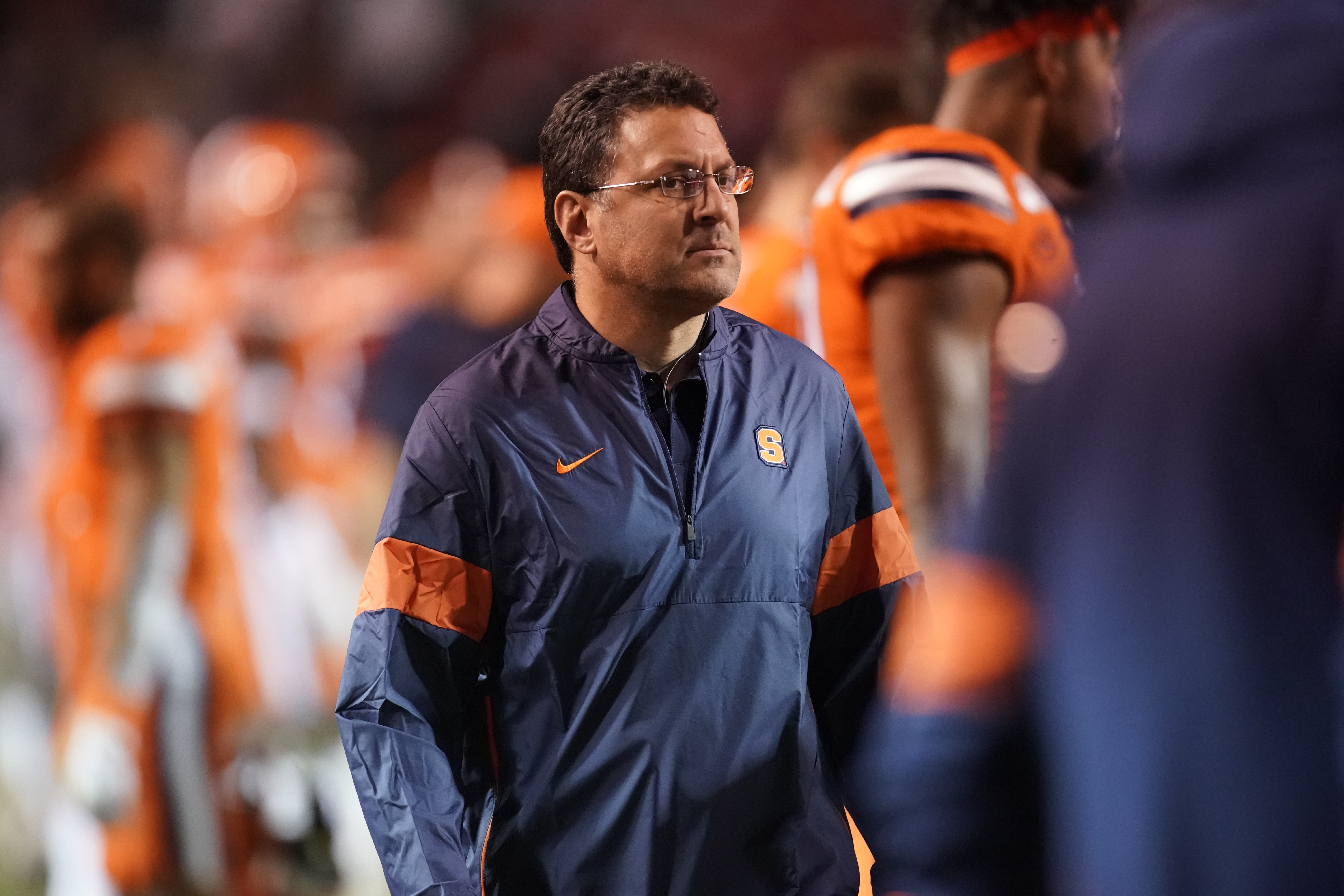 Doctor Todd Battaglia on the field with SU Football