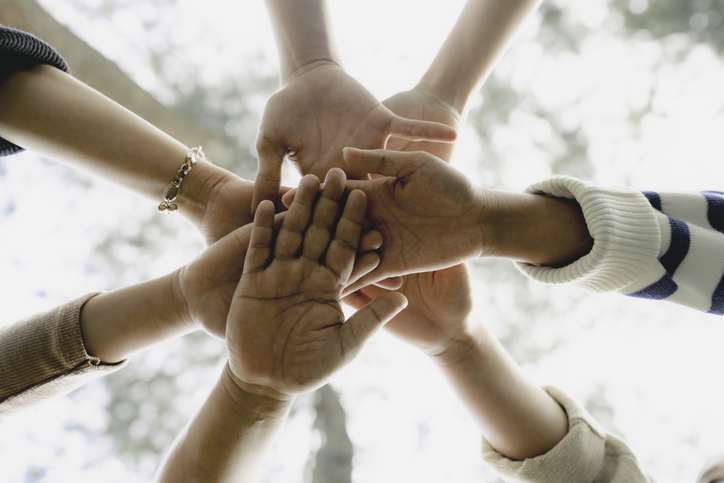 Hands in a circle together