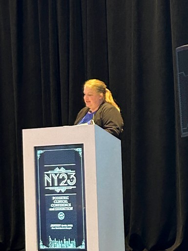 Dr. Stephanie Hook at the podium presenting at NY23 Podiatric Clinical Conference